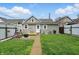 Well-maintained backyard featuring a cozy patio with a swing, fire pit, and a lush green lawn at 842 Miller Ave, Shelbyville, IN 46176