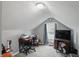 Cozy bedroom featuring vaulted ceilings, a desk, and natural light from the window at 842 Miller Ave, Shelbyville, IN 46176