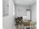 Dining room features a wood dining table and chairs, hardwood floors, and light gray painted walls at 842 Miller Ave, Shelbyville, IN 46176