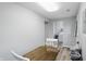 Dining area featuring a table with chairs, vinyl flooring, and utility closet in the background at 842 Miller Ave, Shelbyville, IN 46176