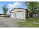Exterior of a two car garage, set in a peaceful and well-maintained environment at 842 Miller Ave, Shelbyville, IN 46176
