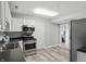 Well-equipped kitchen with modern stainless steel appliances and sleek countertops at 842 Miller Ave, Shelbyville, IN 46176