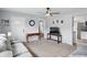 Bright living room featuring hardwood-style floors and a ceiling fan at 842 Miller Ave, Shelbyville, IN 46176