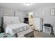 Serene main bedroom with ample natural light, closet, and ensuite bathroom access at 842 Miller Ave, Shelbyville, IN 46176
