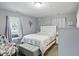 Calming main bedroom with natural light, neutral tones, and comfortable furnishings at 842 Miller Ave, Shelbyville, IN 46176