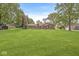 Expansive backyard with lush green lawn and mature trees, perfect for outdoor activities and relaxation at 8814 E 146Th St, Noblesville, IN 46060
