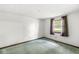 Bedroom with light blue carpet, a window, and minimal features at 8814 E 146Th St, Noblesville, IN 46060