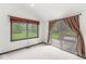 Cozy bedroom with natural light, deck access, and a sliding glass door for convenient outdoor enjoyment at 8814 E 146Th St, Noblesville, IN 46060