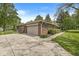 A single-story brick home with an attached garage, green shutters, and a well-manicured front garden at 8814 E 146Th St, Noblesville, IN 46060