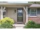 Close-up of a charming home's front entrance with a decorative glass door, sidelight, and inviting curb appeal at 8814 E 146Th St, Noblesville, IN 46060