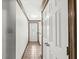 The hallway leads to a front door featuring decorative glass and tile flooring at 8814 E 146Th St, Noblesville, IN 46060