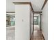 Hallway shows carpet, tile, and wood trim leading to other rooms in the house at 8814 E 146Th St, Noblesville, IN 46060