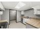 Bright kitchen with plenty of natural light, updated appliances, and convenient access to a storage space at 8814 E 146Th St, Noblesville, IN 46060