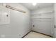 Practical laundry room featuring plenty of storage space, and gray walls complemented by tile flooring for easy maintenance at 8814 E 146Th St, Noblesville, IN 46060