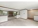 Open living area with fireplace, plush carpeting, and wood trim accents at 8814 E 146Th St, Noblesville, IN 46060