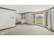 Bright living room with bay window, new carpeting, wood trim, and street view at 8814 E 146Th St, Noblesville, IN 46060