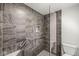 Modern shower has sleek tile, grab bars and glass door at 8814 E 146Th St, Noblesville, IN 46060