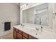 Bright bathroom featuring double sink vanity with abundant counter space and storage at 8855 Banner Dr, Brownsburg, IN 46112