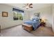 Cozy bedroom with a large window, ceiling fan, and stylish furnishings at 8855 Banner Dr, Brownsburg, IN 46112