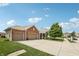 Brick and vinyl sided home with large three car garage and front yard at 8855 Banner Dr, Brownsburg, IN 46112