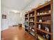 Entryway featuring hardwood floors, a built-in bookcase, and a glimpse of the front door, creating a welcoming atmosphere at 8855 Banner Dr, Brownsburg, IN 46112