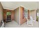 Cozy covered front porch with rocking chairs and decorative details at 8855 Banner Dr, Brownsburg, IN 46112