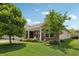 Charming single-story home with a well-manicured lawn and mature trees at 8855 Banner Dr, Brownsburg, IN 46112
