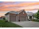 Charming home with a three-car garage, brick accents, and beautiful landscaping, perfect for families at 8855 Banner Dr, Brownsburg, IN 46112