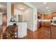 An inviting kitchen featuring rich wood cabinets, stainless steel appliances, and a cozy adjoining nook at 8855 Banner Dr, Brownsburg, IN 46112