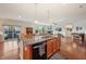 Open kitchen with a large island, stainless appliances, and connection to a dining area and living room at 8855 Banner Dr, Brownsburg, IN 46112