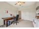 Functional office featuring a ceiling fan, desk, and built-in shelving for optimal organization and comfort at 8855 Banner Dr, Brownsburg, IN 46112