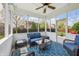 Relaxing sunroom with comfortable seating, ceiling fan, and scenic backyard views at 8855 Banner Dr, Brownsburg, IN 46112