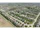 Wide aerial view showcases a neighborhood with green spaces, a pond and a location marker at 996 Denton Ct, Westfield, IN 46074