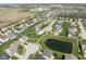 Panoramic aerial view showcasing a residential area with a pond, walking trail and green spaces at 996 Denton Ct, Westfield, IN 46074