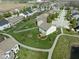 Overhead view of a house with a large backyard, patio, and a walking path behind it at 996 Denton Ct, Westfield, IN 46074