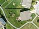 Aerial view of a well-maintained backyard with a patio and lush green grass at 996 Denton Ct, Westfield, IN 46074