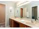Bathroom with double vanity, lots of counter space, large mirror, and natural lighting at 996 Denton Ct, Westfield, IN 46074