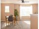 Bright dining room with neutral walls, ceiling fan, and a large window with natural light at 996 Denton Ct, Westfield, IN 46074