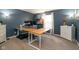 A spacious home office with a desk and shelves gets lots of natural light at 996 Denton Ct, Westfield, IN 46074