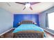 Inviting bedroom features an upholstered bed, a ceiling fan, and wood flooring at 10090 Eagle Eye Way, Indianapolis, IN 46234