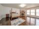 Bedroom featuring a four-poster bed and a cozy fireplace at 10090 Eagle Eye Way, Indianapolis, IN 46234