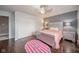 Comfortable bedroom featuring a sleek bedframe, modern ceiling fan, and neutral wall color scheme at 10090 Eagle Eye Way, Indianapolis, IN 46234
