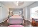 Cozy bedroom featuring a stylish silver frame bed, a ceiling fan, and a well-lit interior at 10090 Eagle Eye Way, Indianapolis, IN 46234