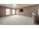 Spacious bonus room features neutral walls, carpet flooring, and two large windows that offer great natural light at 10090 Eagle Eye Way, Indianapolis, IN 46234