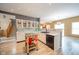 Spacious eat-in kitchen with stainless steel appliances, black sink fixtures, and a moveable kitchen island at 10090 Eagle Eye Way, Indianapolis, IN 46234