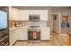 Well-equipped kitchen features stainless steel appliances, white cabinets, marble countertops, and modern backsplash at 10090 Eagle Eye Way, Indianapolis, IN 46234