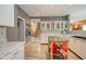 Bright, open kitchen features a moveable kitchen island, stainless steel appliances, modern backsplash, and plenty of storage at 10090 Eagle Eye Way, Indianapolis, IN 46234
