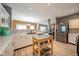 Open concept kitchen features stainless steel appliances, a moveable kitchen island, and modern cabinetry at 10090 Eagle Eye Way, Indianapolis, IN 46234