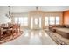 Open-concept living space with a dining area, sofa, ample natural light, and a welcoming foyer at 10090 Eagle Eye Way, Indianapolis, IN 46234