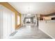 Open-concept living area with a dining space, views into a Gathering room, and sleek flooring at 10090 Eagle Eye Way, Indianapolis, IN 46234